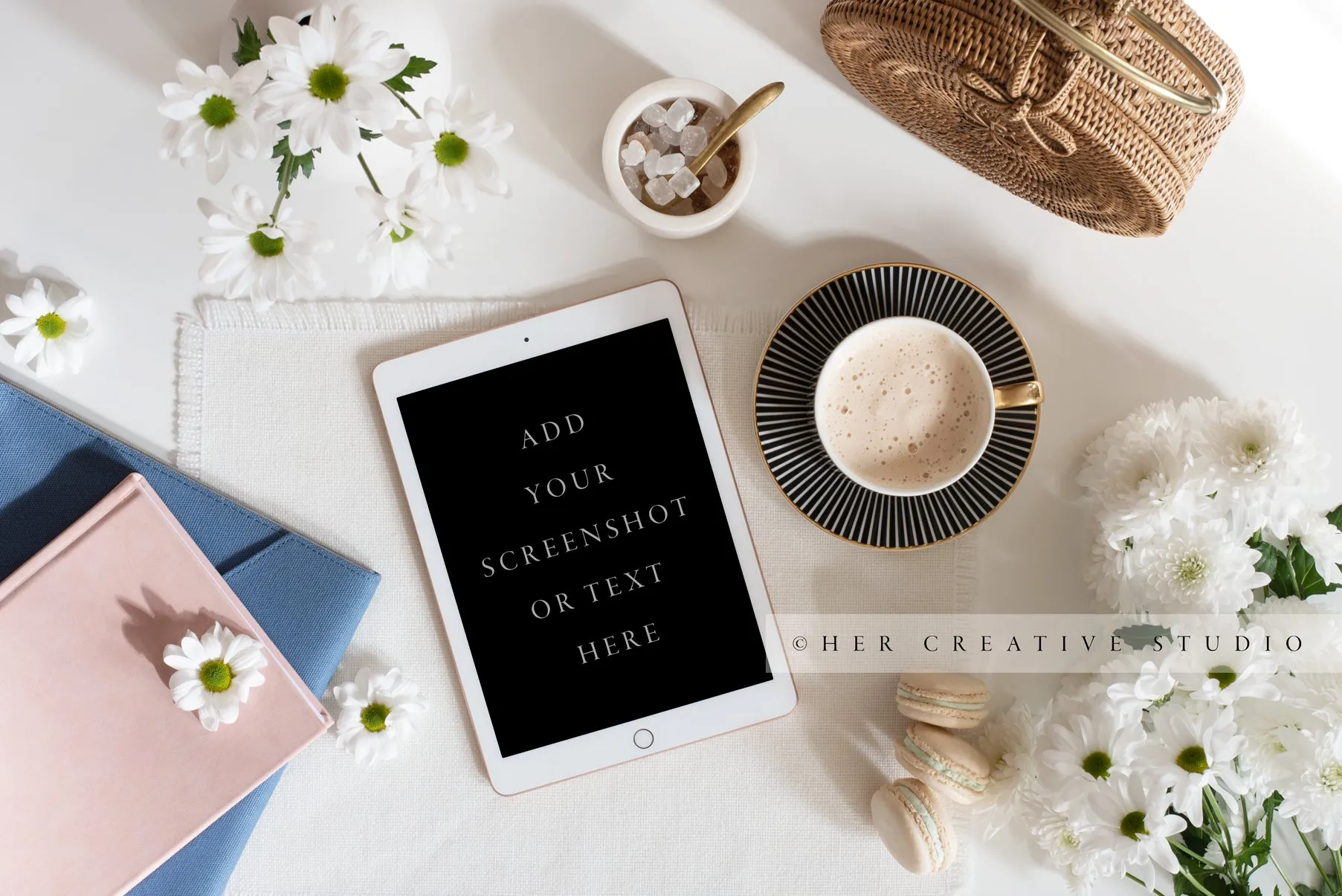 Tablet, Notebooks & Daisies. Styled Image.